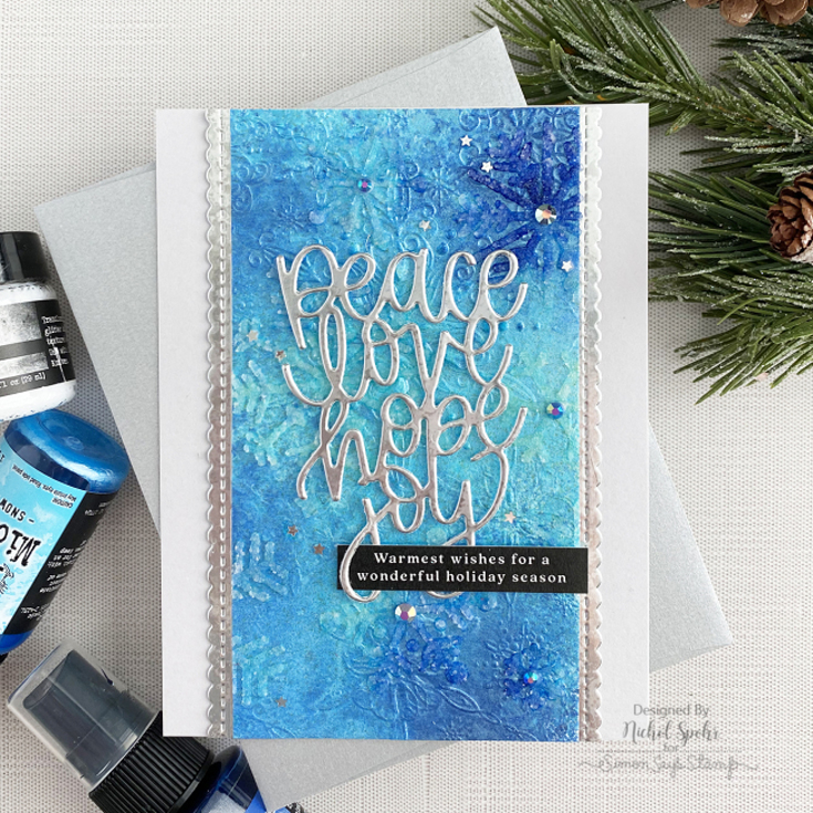 Nichole Spohr World Card Making Day 2021 Filigree Snowflakes embossing folder, Peace Love Hope Joy die, and Reverse Merriest Christmas sentiment strips