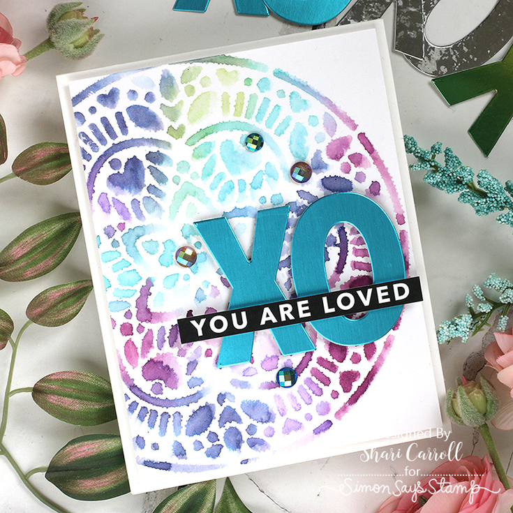 And Back Again Blog Hop Shari Carroll Reverse Sassy Love sentiment strips, Big XOXO Die, and Layering Heart Mandala stencil