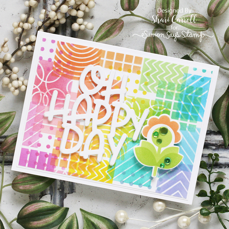 Out of This World Blog Hop Shari Carroll Oh Happy Day die, Layered Pixie Flowers stencil and coordinating die, Patterned Squares stencil, Green Meadows sequins, and Pawsitively Saturated Green Meadows and Yellow Sunsets ink cubes