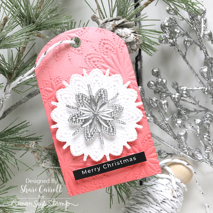 All the Joy Blog Hop Shari Carroll Burst Snowflakes embossing folder, Swatching Tag die, Silver and White Twine, and Reverse Christmas Greetings sentiment strips